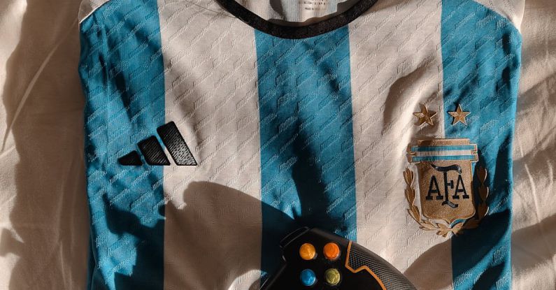 Budget Gaming Rigs - A soccer jersey and a controller on a bed