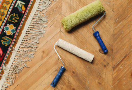 Tools - Paint Rollers Lying on a Wooden Floor 