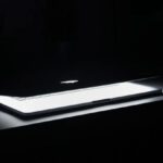 Lighting Setup - Photography of Macbook Half Opened on White Wooden Surface