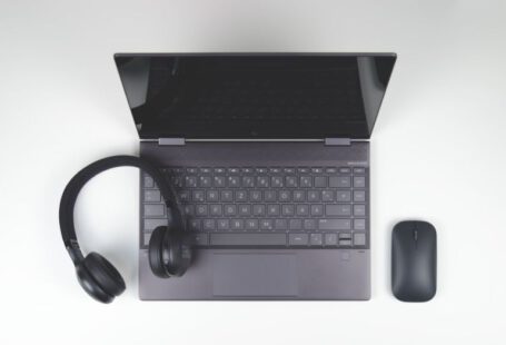 Ultrabooks - a laptop computer with headphones and a mouse